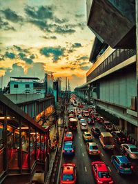 High angle view of traffic on city street at sunset