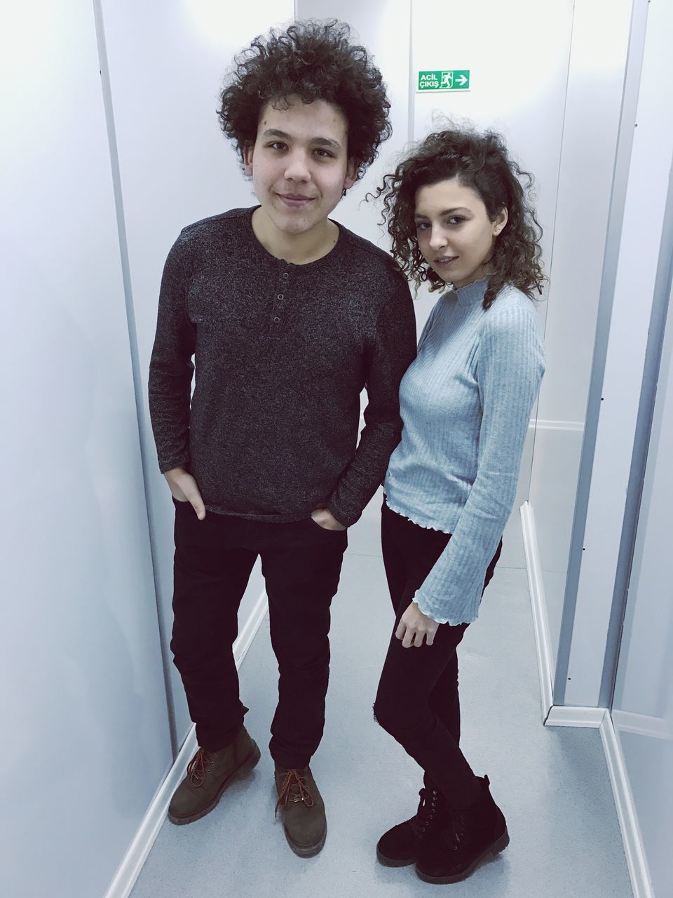 two people, young women, looking at camera, togetherness, real people, full length, standing, lifestyles, portrait, business, curly hair, young adult, people, indoors, day, adult
