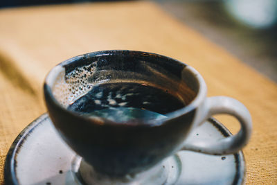 Close-up of coffee cup on table