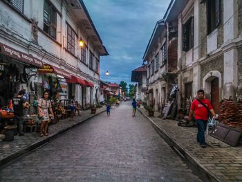 People walking on street in old town