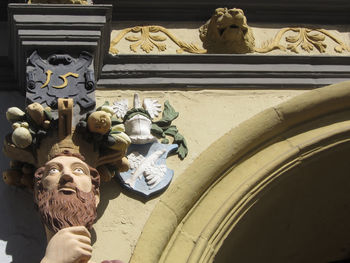 Low angle view of statue against building