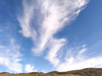 Low angle view of land against sky