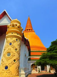 Low angle view of temple against clear blue sky