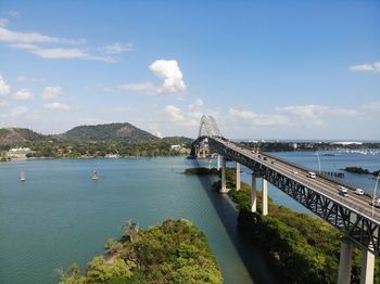 Bridge over sea against sky