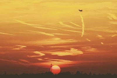 Scenic view of orange sky