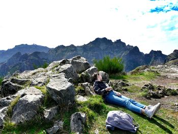 High angle view of rocks in mountains against sky