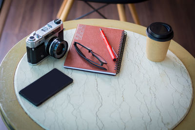 High angle view of smart phone on table