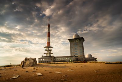 Tower amidst buildings against sky in city