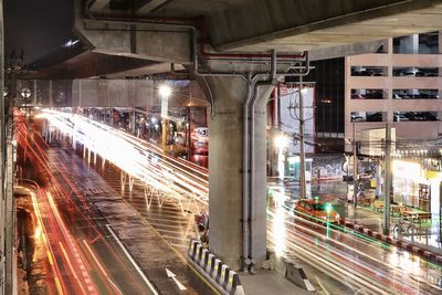 High angle view of light trails on road at night