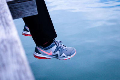 Low section of man against sea