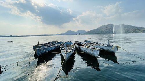 Boats in sea against sky