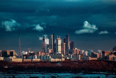 Panoramic view of sea and buildings against sky