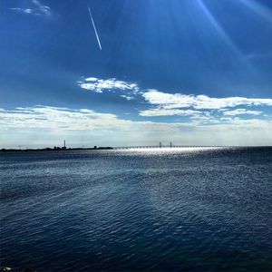 Scenic view of sea against blue sky