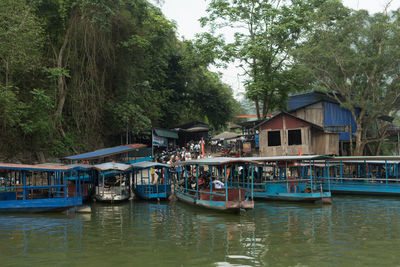 Boats moored at harbor