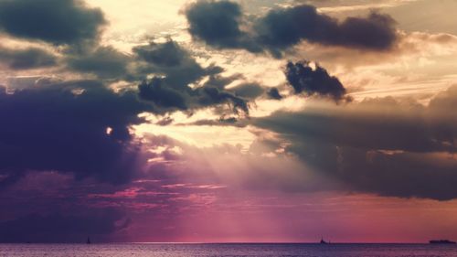 Scenic view of sea against storm clouds