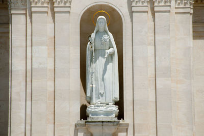 Close-up of white hanging outside building