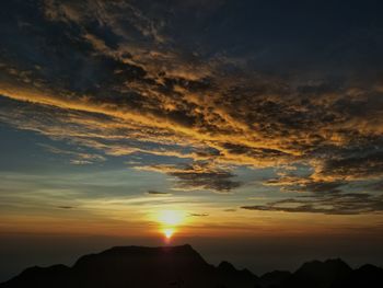 Low angle view of dramatic sky during sunset