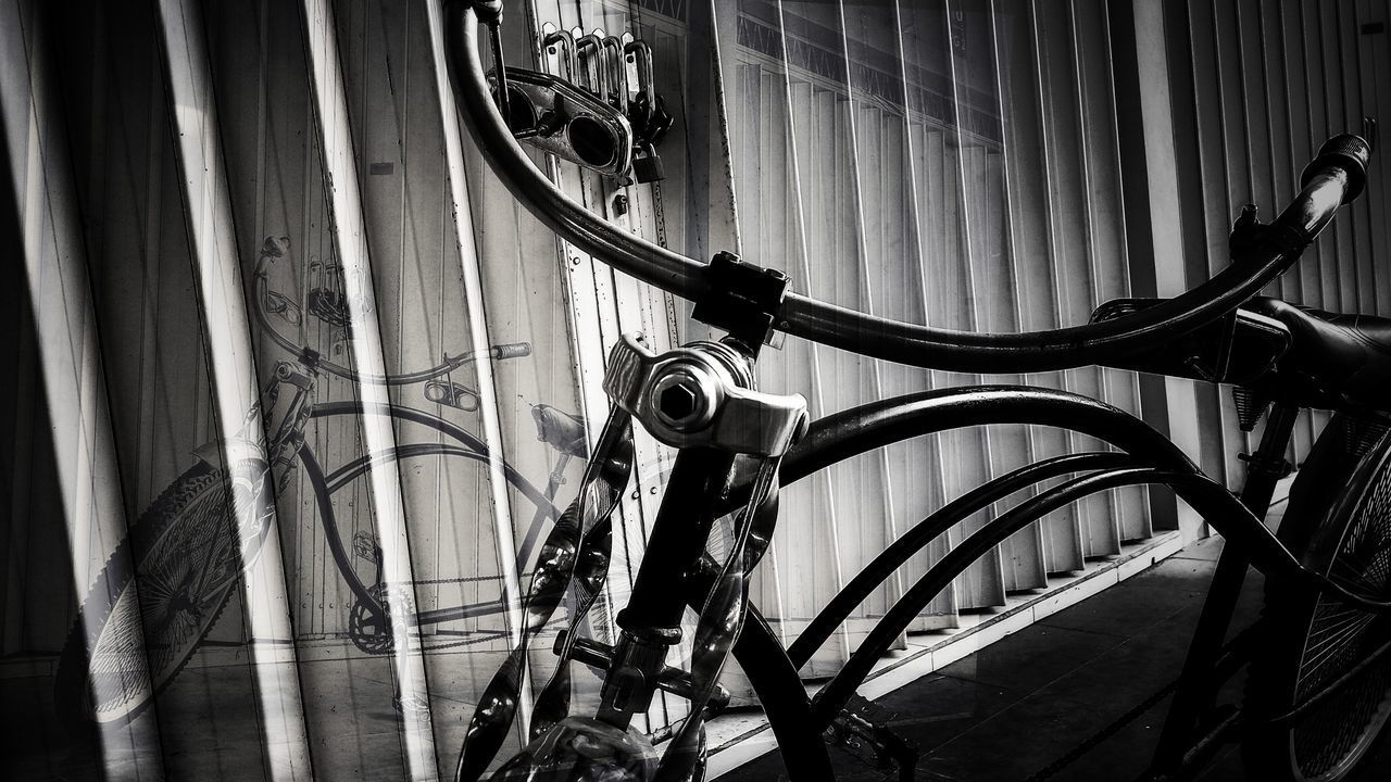 CLOSE-UP OF BICYCLE ON CABLE