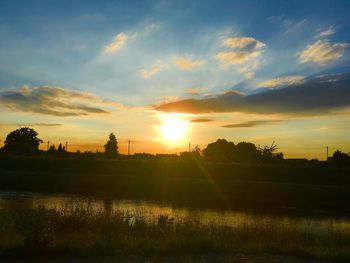 Scenic view of field against sky during sunset