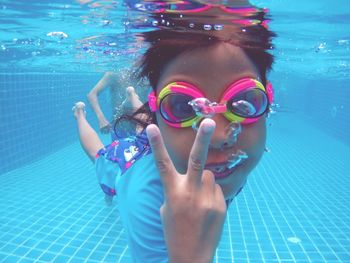 Portrait of woman swimming in pool