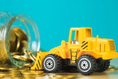 Close-up of toy car against blue background