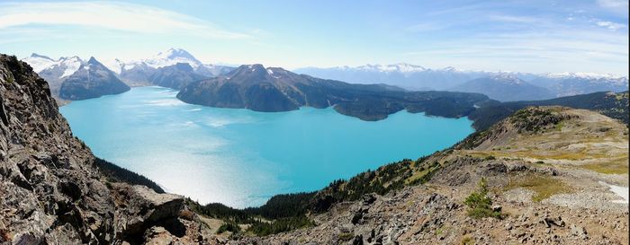 Calm lake against rocky landscape