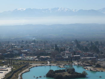 High angle view of buildings and mountains against sky