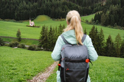 Rear view of woman on grassy field