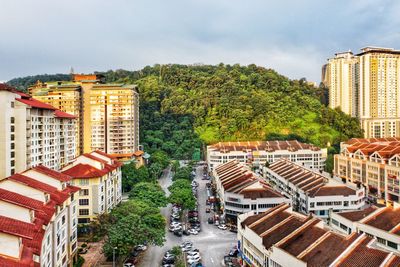 High angle view of buildings and street against sky