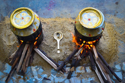 High angle view of candles on barbecue grill