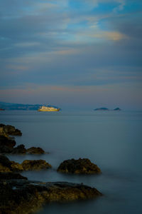 Scenic view of sea against sky at sunset