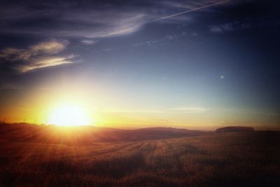 Scenic view of landscape at sunset