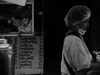Side view of two people standing with text
