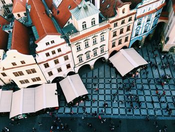 High angle view of people on street by building in city