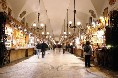 People walking in illuminated market