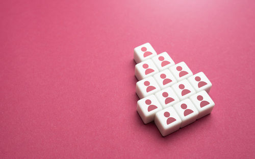 High angle view of dices on yellow background