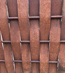 Full frame shot of brown rusty metal in vertical orientation for background use