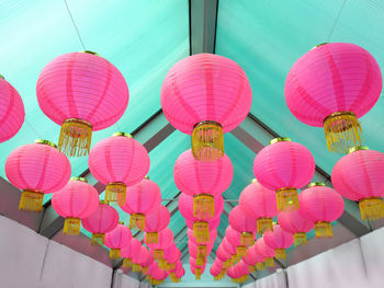 Low angle view of multi colored lanterns hanging on ceiling