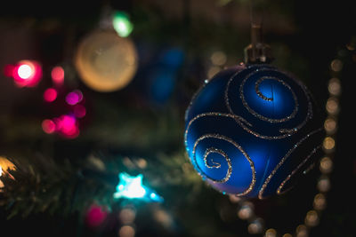 Close-up of illuminated christmas lights at night