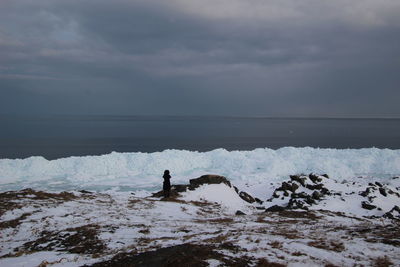 Scenic view of sea against sky during winter