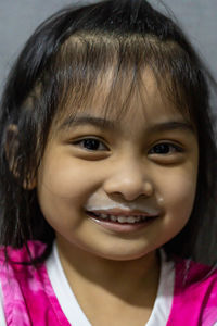 Close-up portrait of a smiling girl