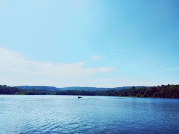 Scenic view of lake against blue sky