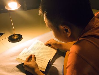 Portrait of man reading book