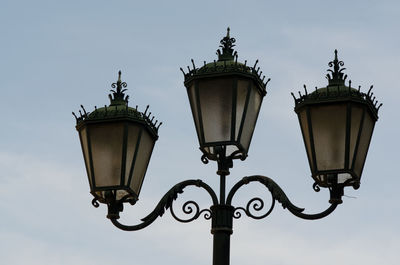 Low angle view of street light against sky