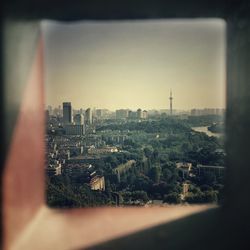 Aerial view of cityscape against sky