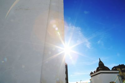 Low angle view of building against sky on sunny day