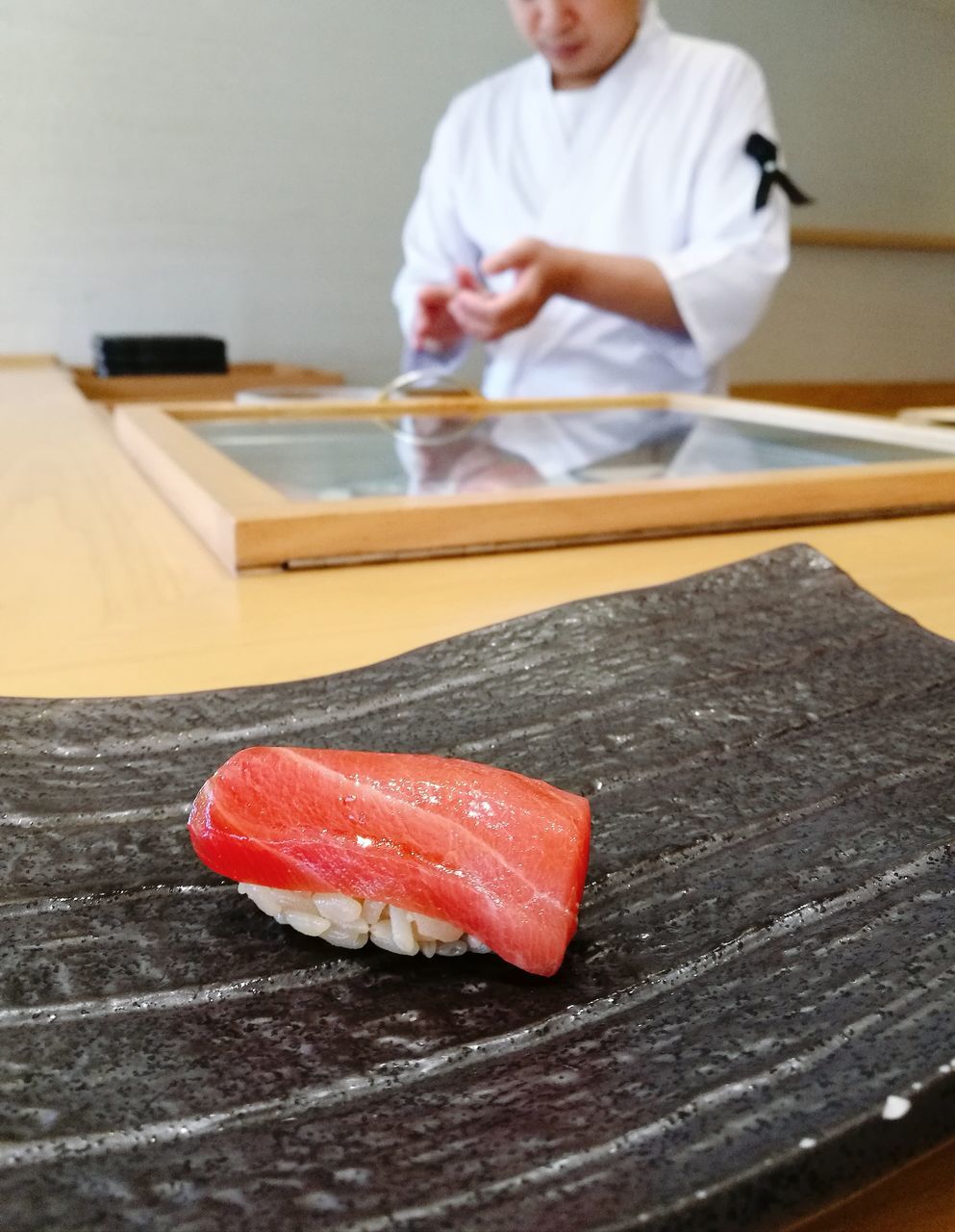 CLOSE-UP OF MAN PREPARING FOOD