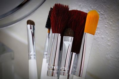 Close-up of make-up brushes on table