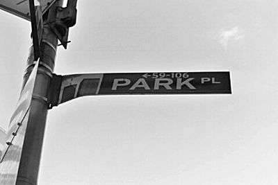 Low angle view of sign board against clear sky