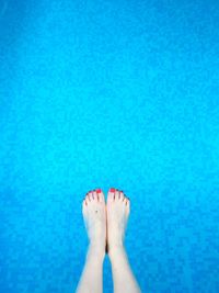 Low section of woman in swimming pool